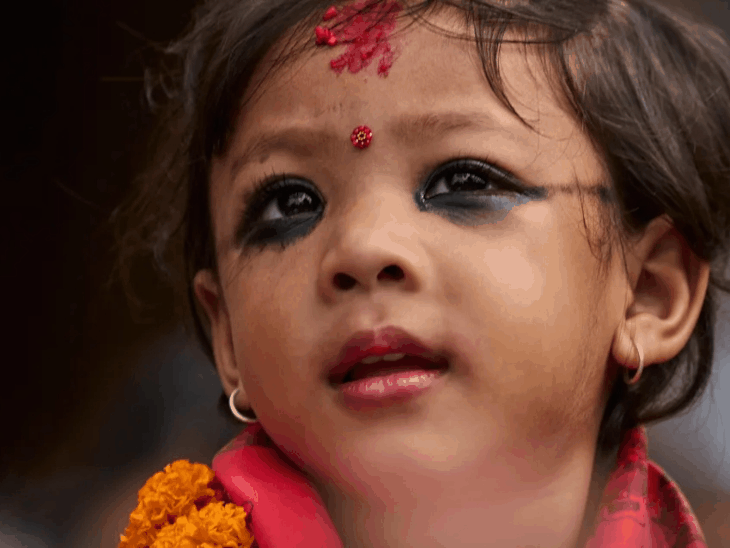 In Nepal, a 2-year-old girl was elected a goddess. Her father carried her to the temple in his lap; the position had become vacant due to the previous goddess’s menstruation.